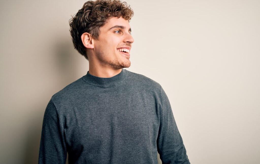 Young blond handsome man with curly hair