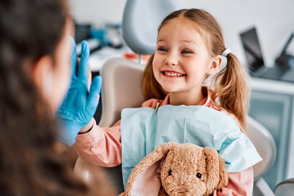 candid emotional child sitting in a dental chair