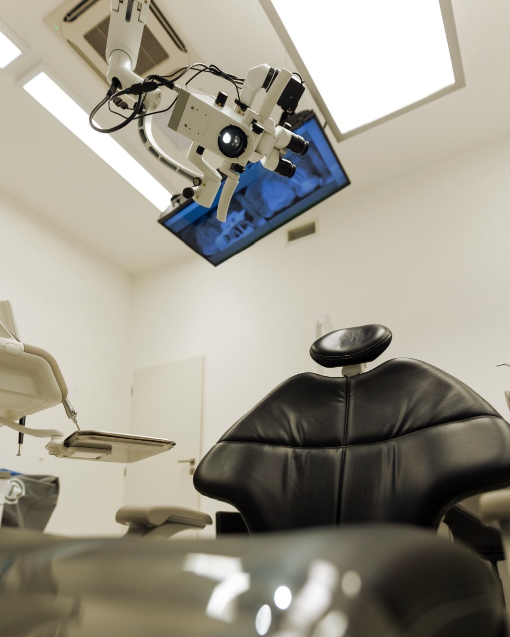 Dental treatment clinic interior with modern patient chair